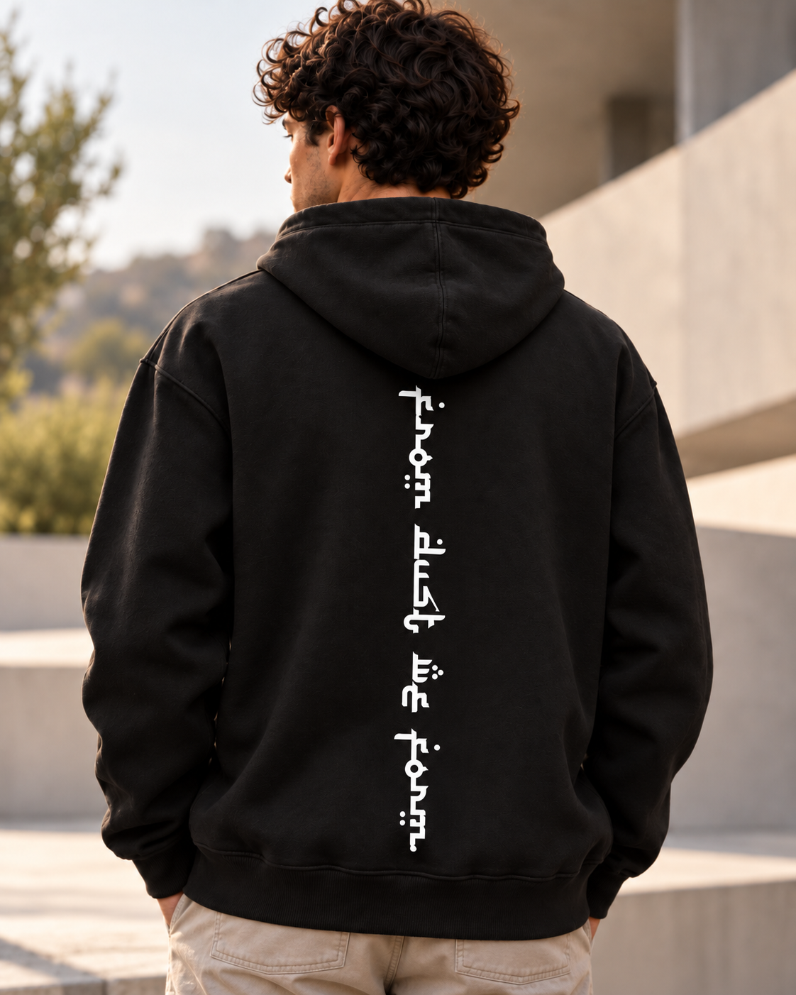 Dust Apparel black hoodie photographed from behind